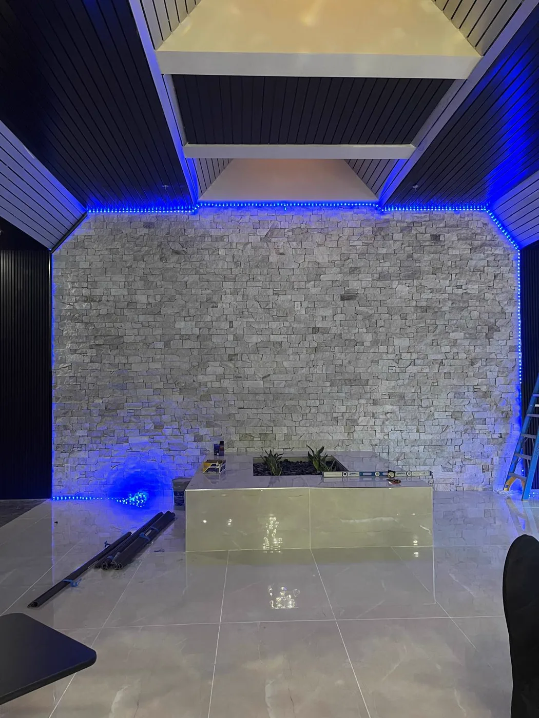 Stone feature wall with accent lighting, commercial venue renovation, Metro Atlanta