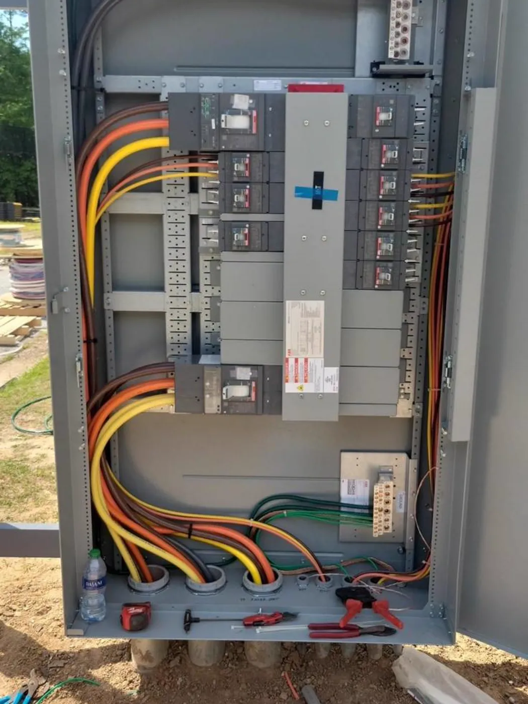 New electrical distribution panel wired and labelled with colour-coded feeders, Metro Atlanta